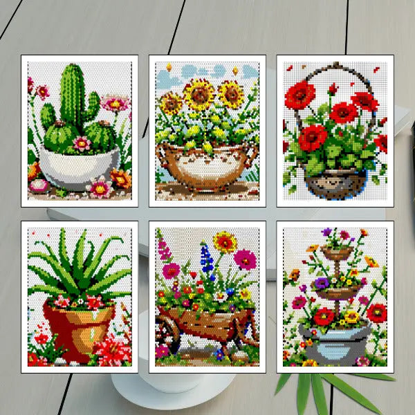Six colorful completed color by number mosaic art pieces featuring various flower and plant pots, including a cactus, sunflowers in a bowl, red poppies in a hanging basket, an aloe plant, a wheelbarrow with mixed flowers, and a tiered planter with blooms.