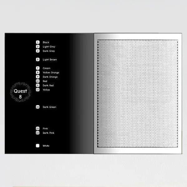 An open color by number book showing a page with a color key on the left and a blank mosaic pattern on the right.