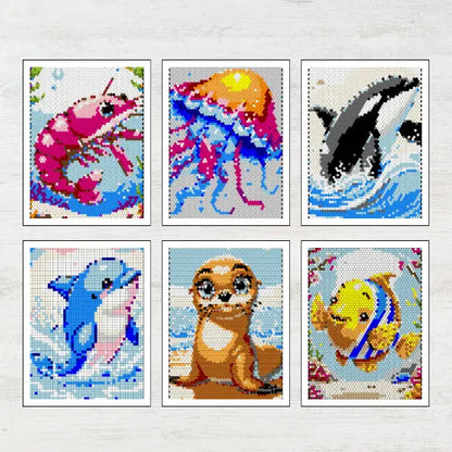 Set of six vibrant completed sea animal mosaic art prints, featuring a shrimp, jellyfish, orca, dolphin, sea lion pup, and a colorful tropical fish.